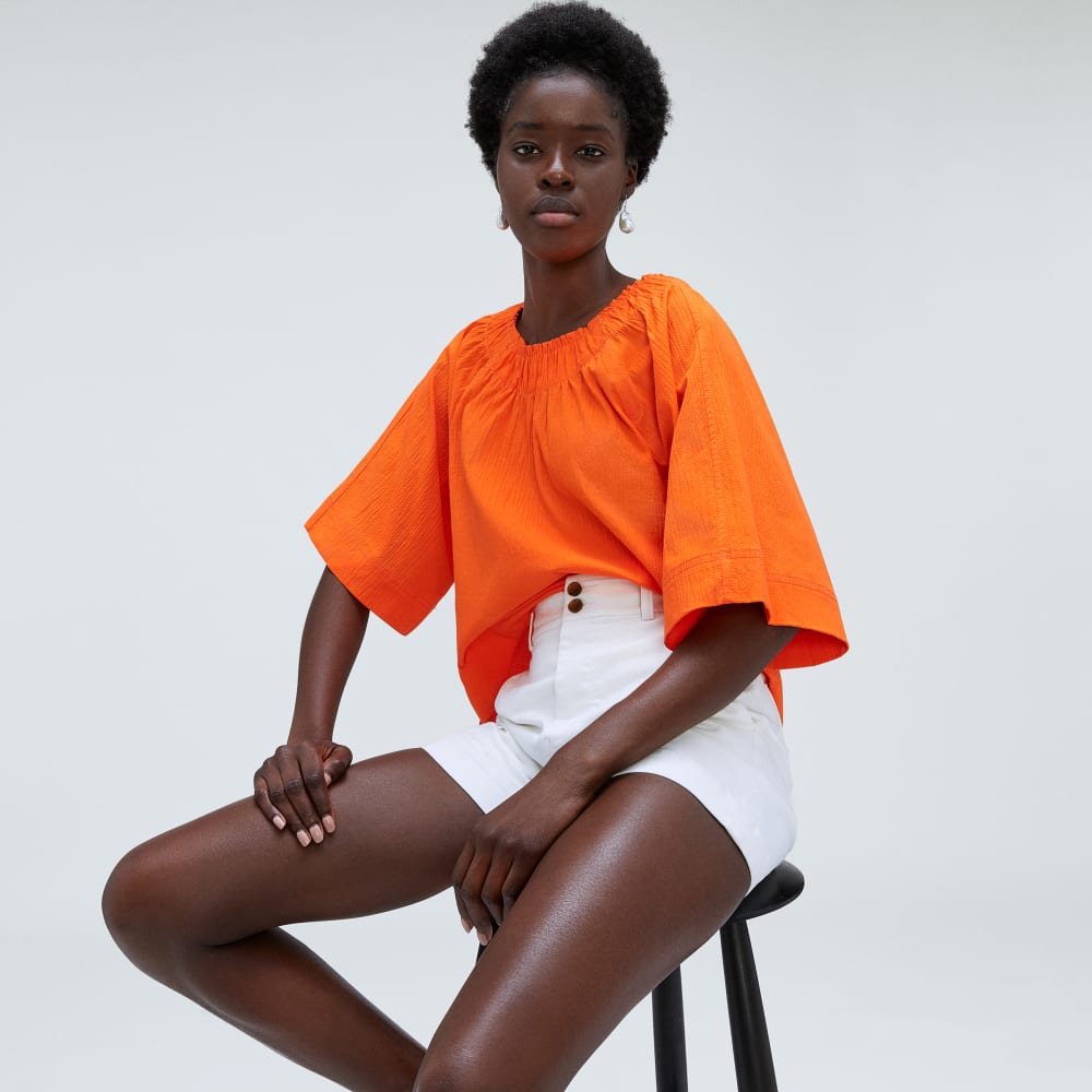 The Seersucker Gathered Tee in Bright Orange — detail view