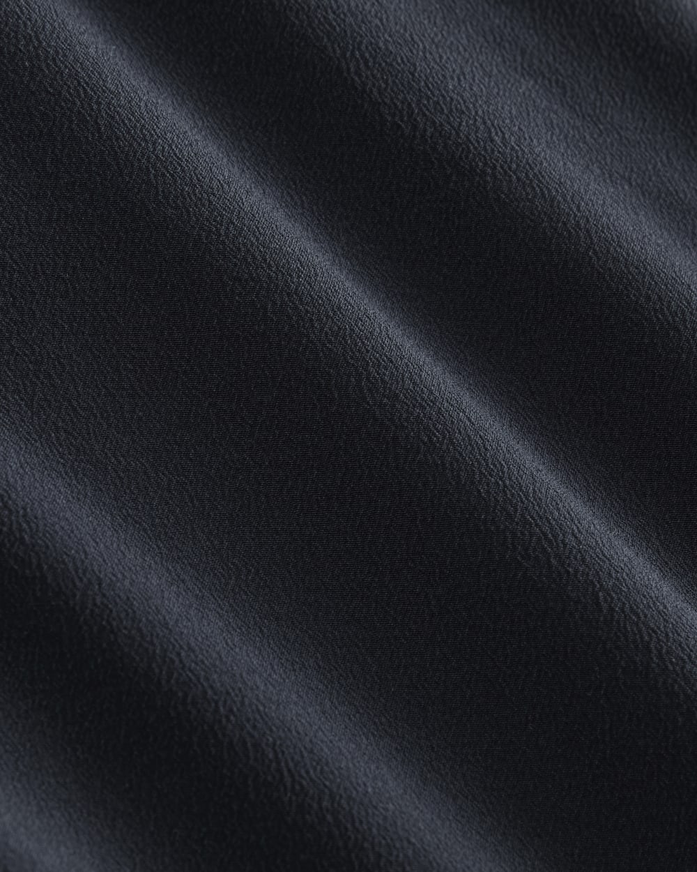 The Boxy Shirt in Washable Silk in Navy — detail view