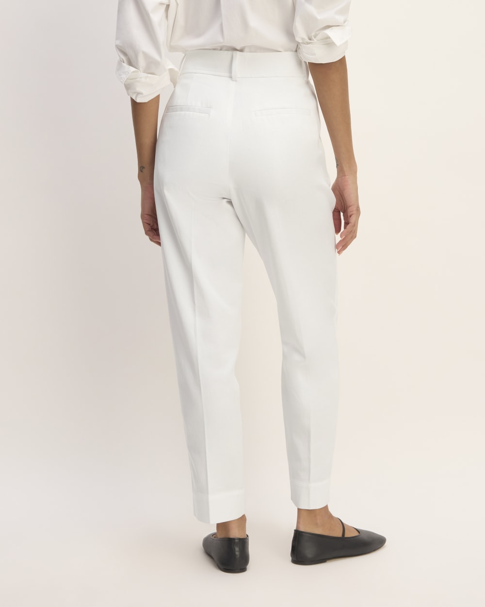 The Draper Tapered Pant in Buttersmooth in White — detail view