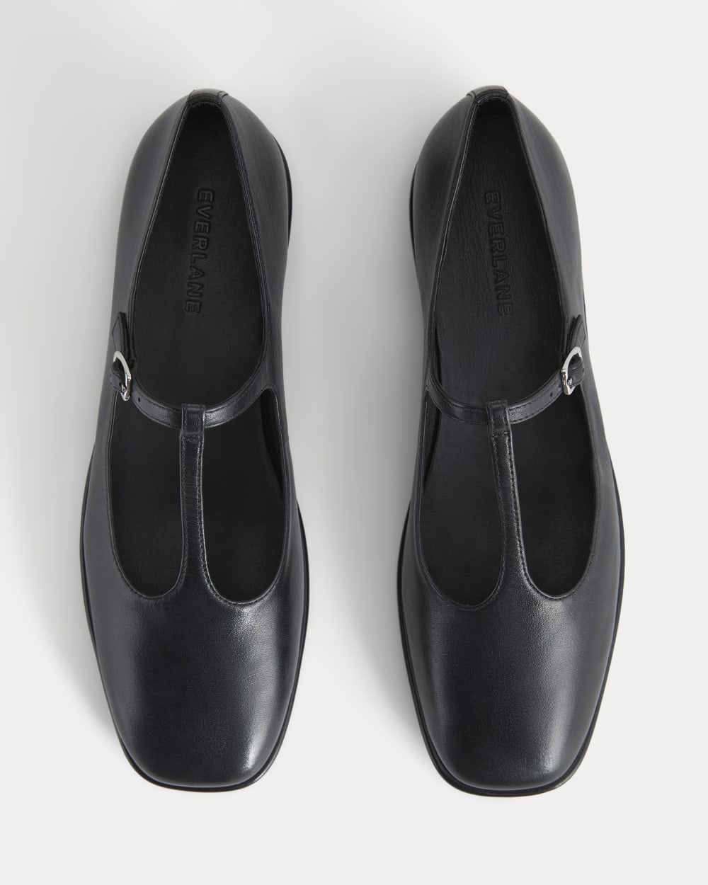 The Leather T-Strap Flat in Black — detail view