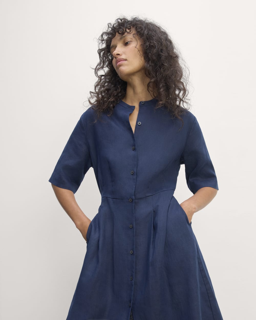 The Frolic Dress in Linen in Navy — detail view