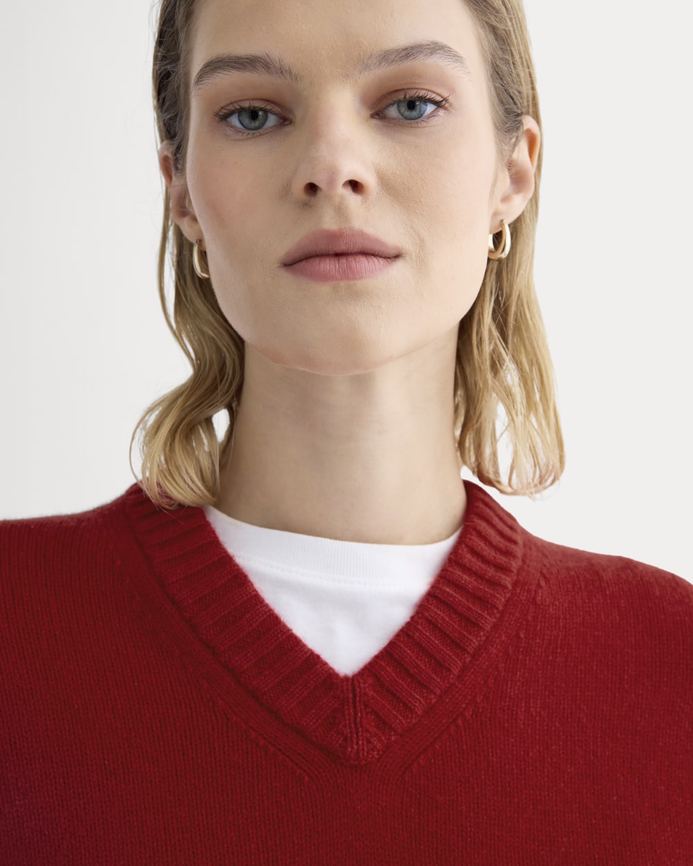 V-Neck Sweater in Extrafine Luxe Merino in Berry Red — detail view