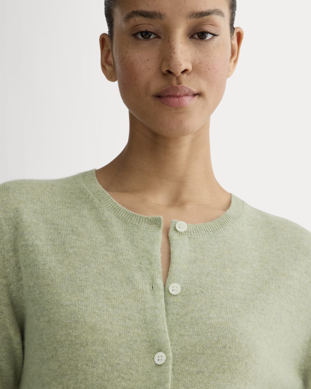 The Classic Cardigan in Cashmere in Light Heathered Moss — detail view