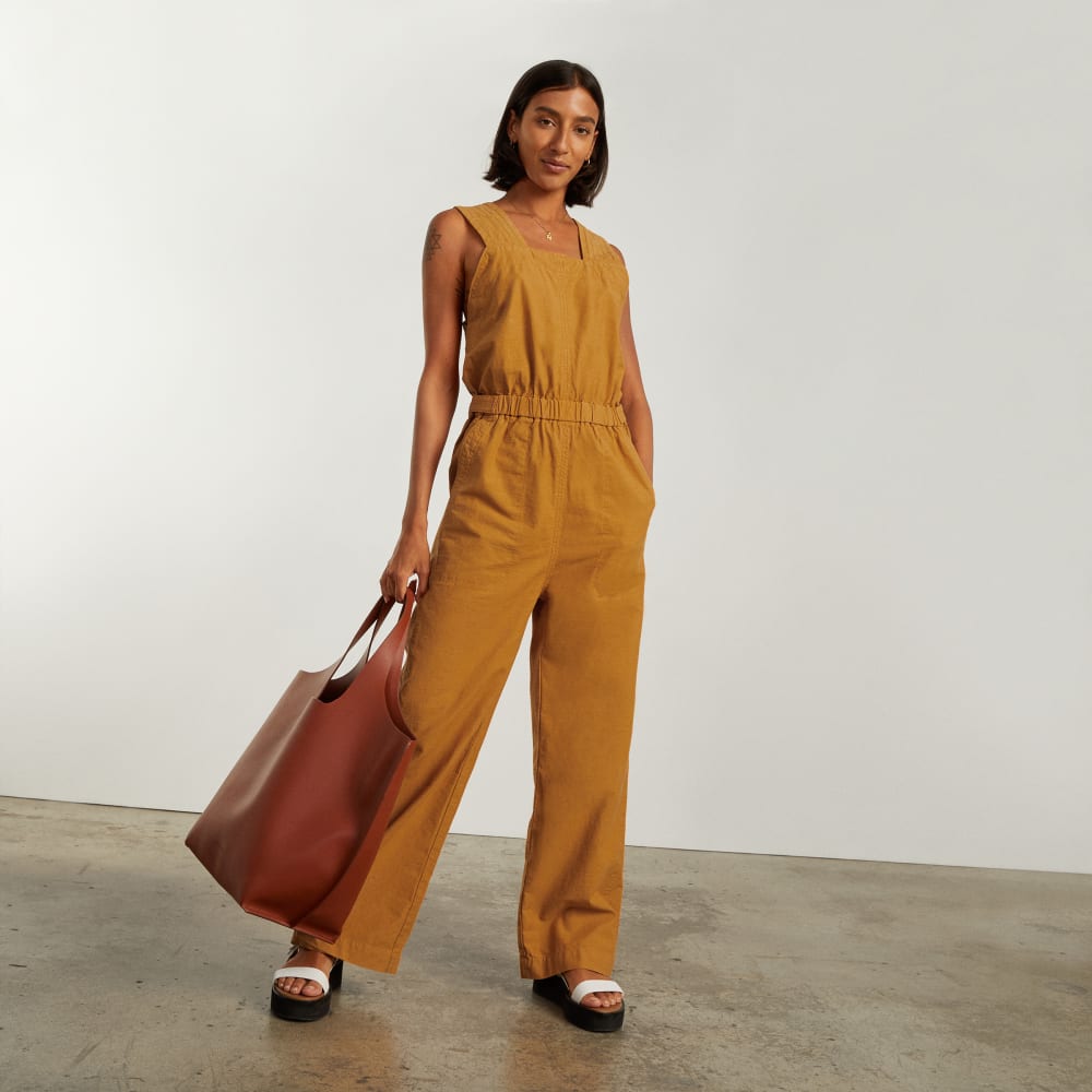 The Fatigue Apron Jumpsuit in Amber — detail view