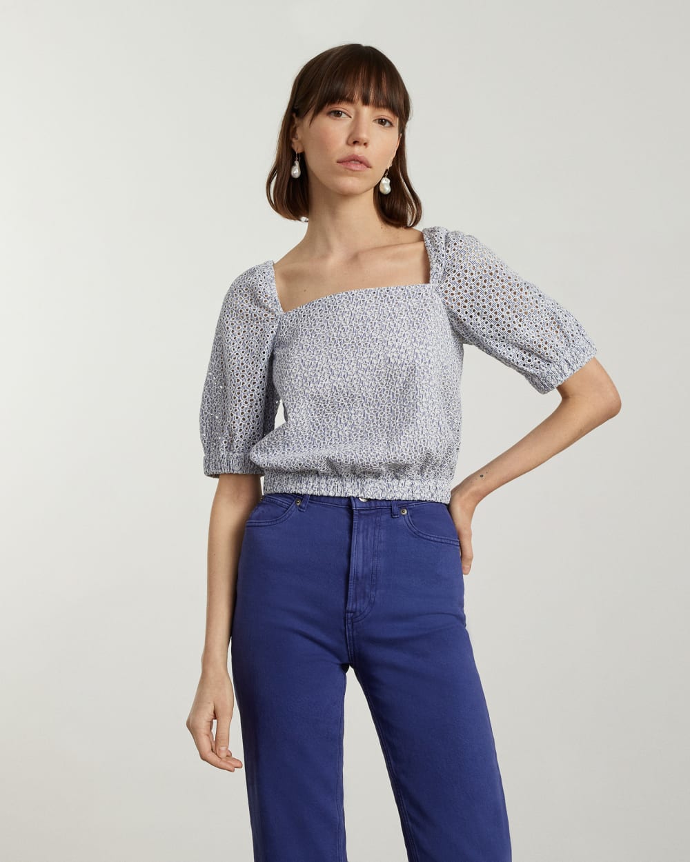 The Eyelet Puff Sleeve Top in Deep Blue / White — detail view