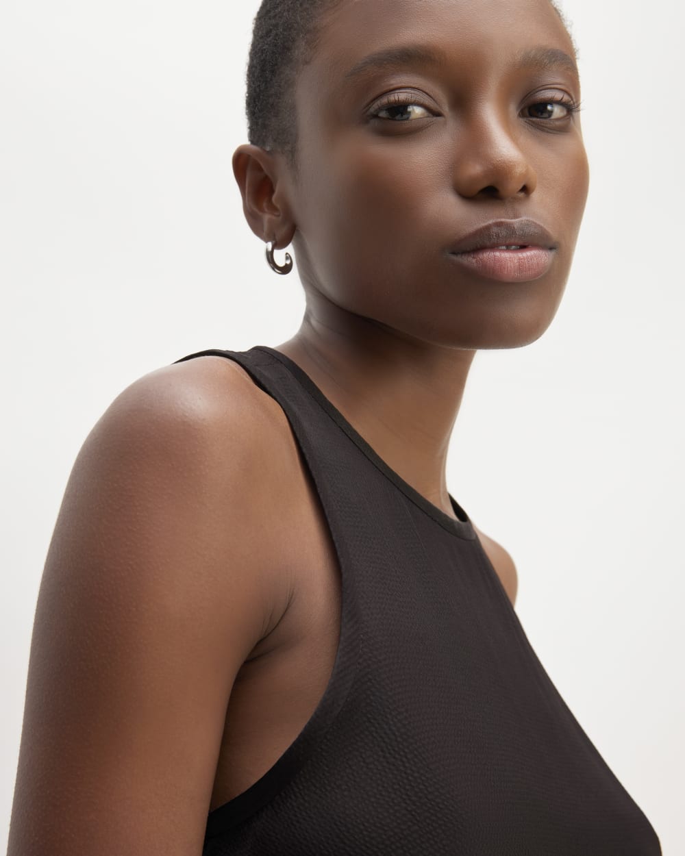 The Satin Racerback Top in Black — detail view