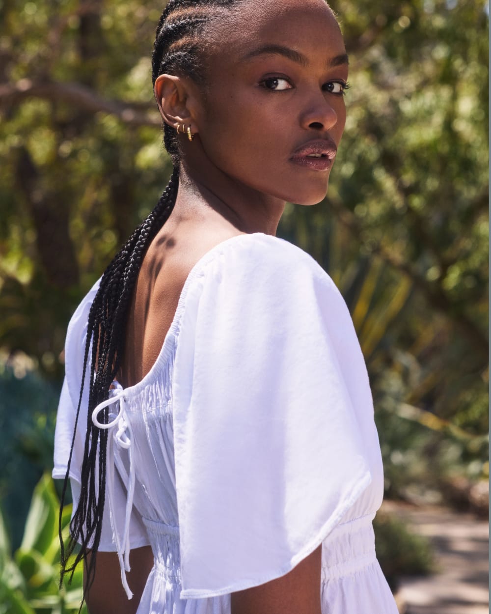The Flutter-Sleeve Dress in Stretch Linen in White — detail view