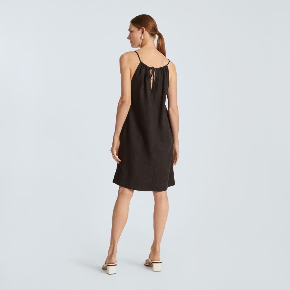 The Linen Apron Dress in Black — detail view