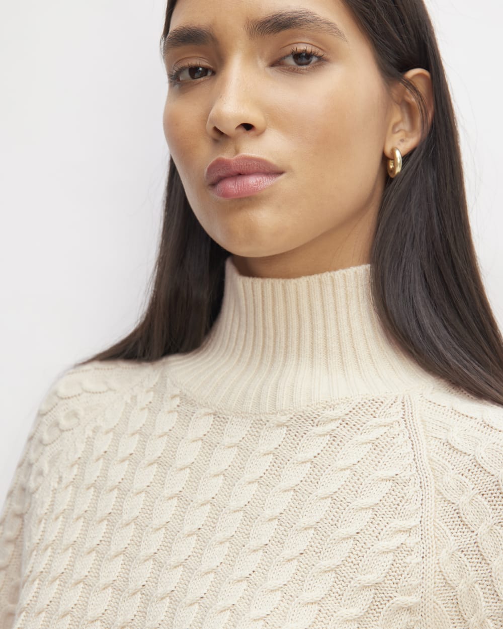 The Cotton Merino Cable Turtleneck in Canvas — detail view