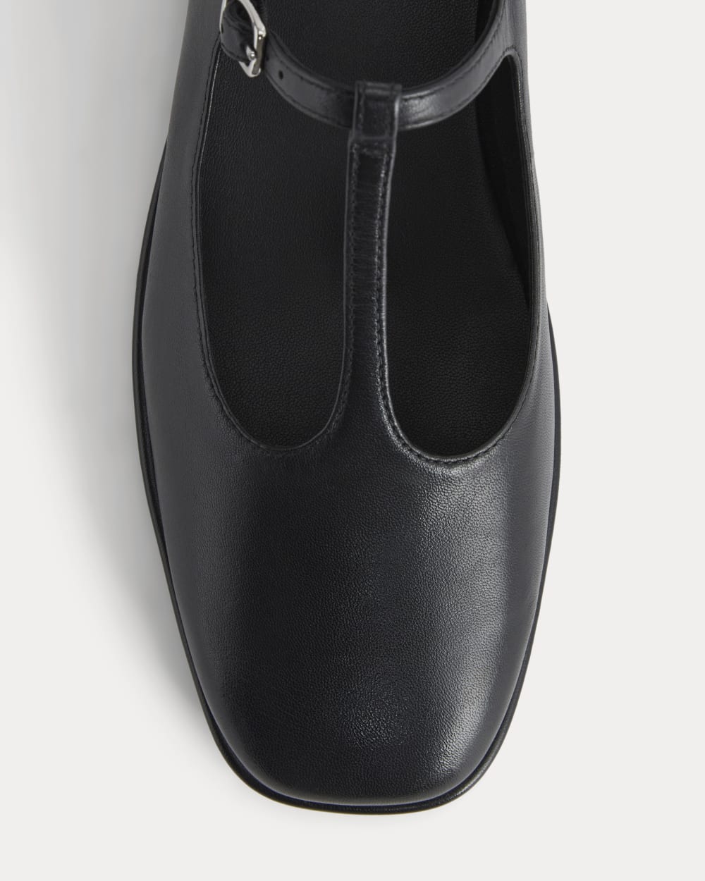 The Leather T-Strap Flat in Black — detail view