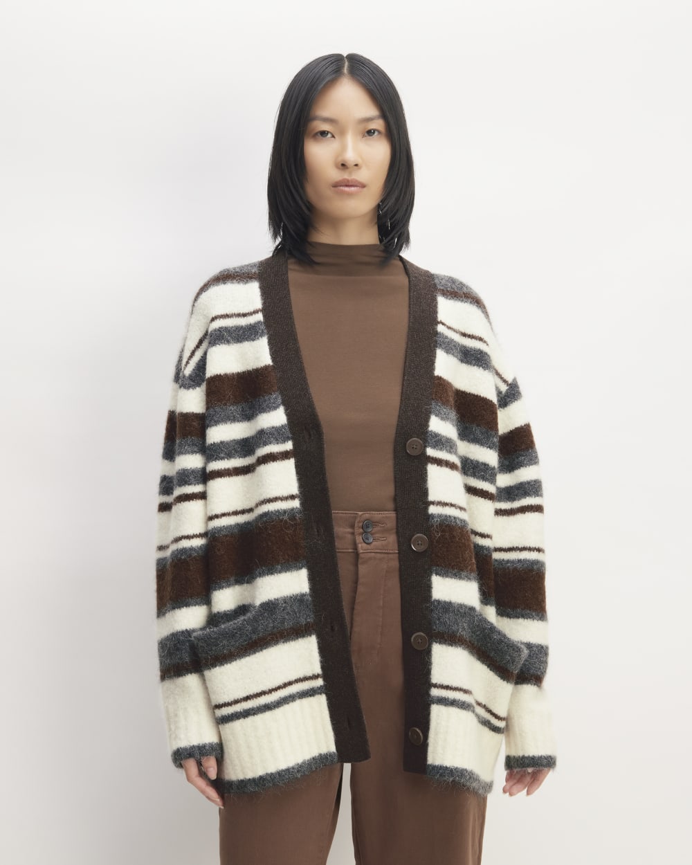 The SuperFuzz Alpaca Cardigan in Bone / Hot Fudge / Heather Charcoal — front view