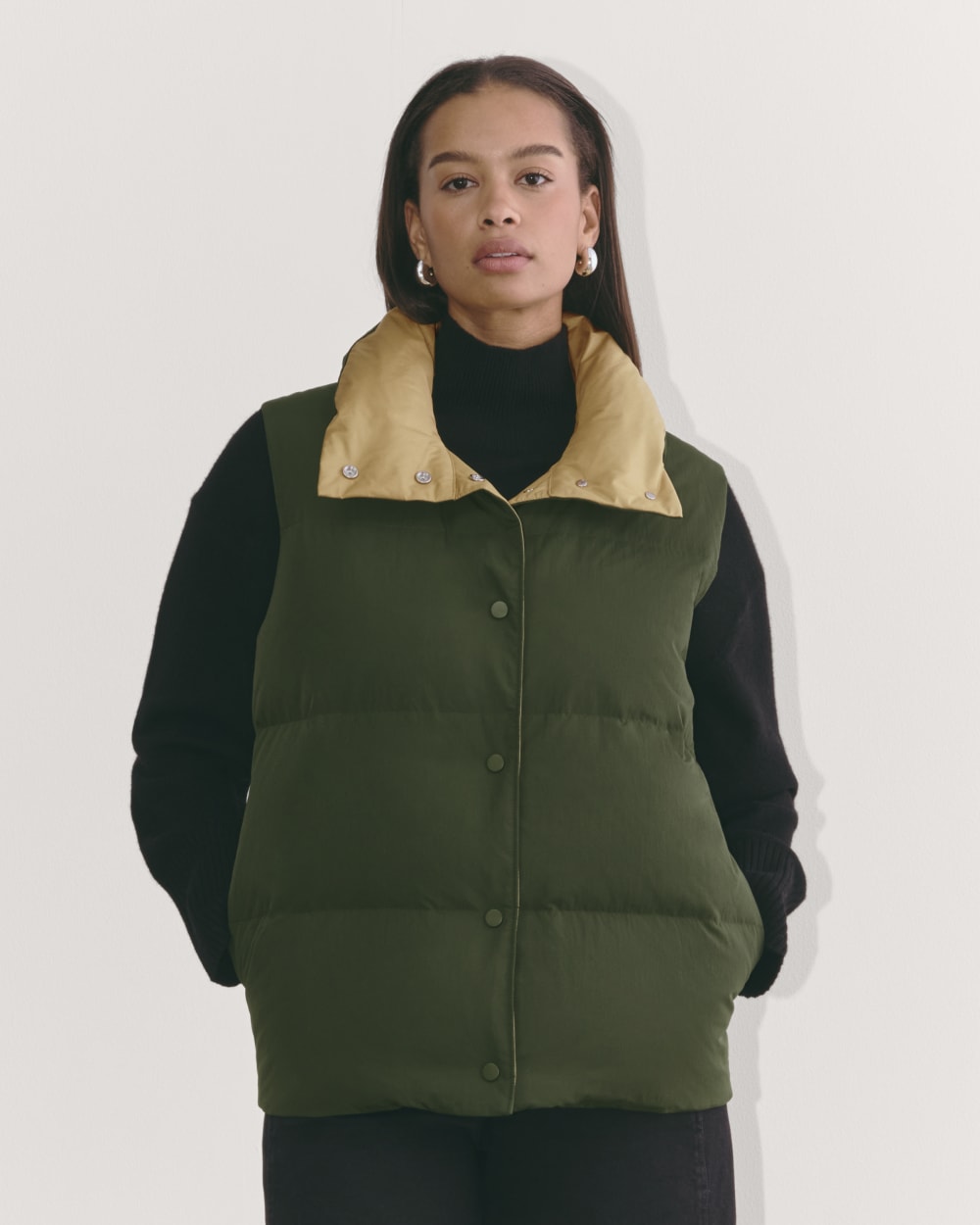 The Puffer Vest in Dark Forest — front view