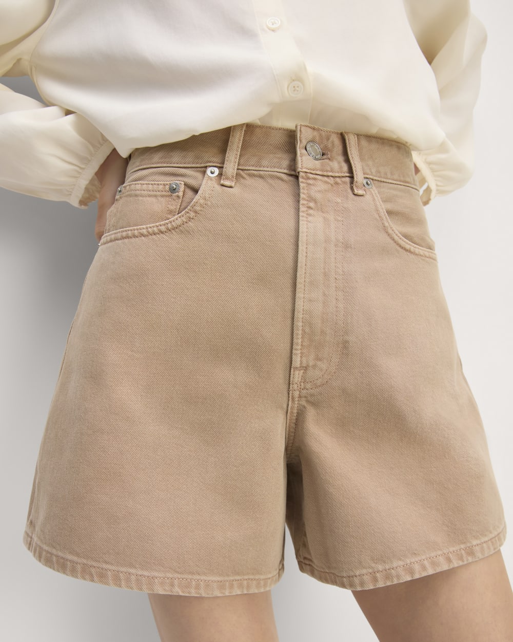 The A-Line Denim Short in Neutral Chanterelle — detail view