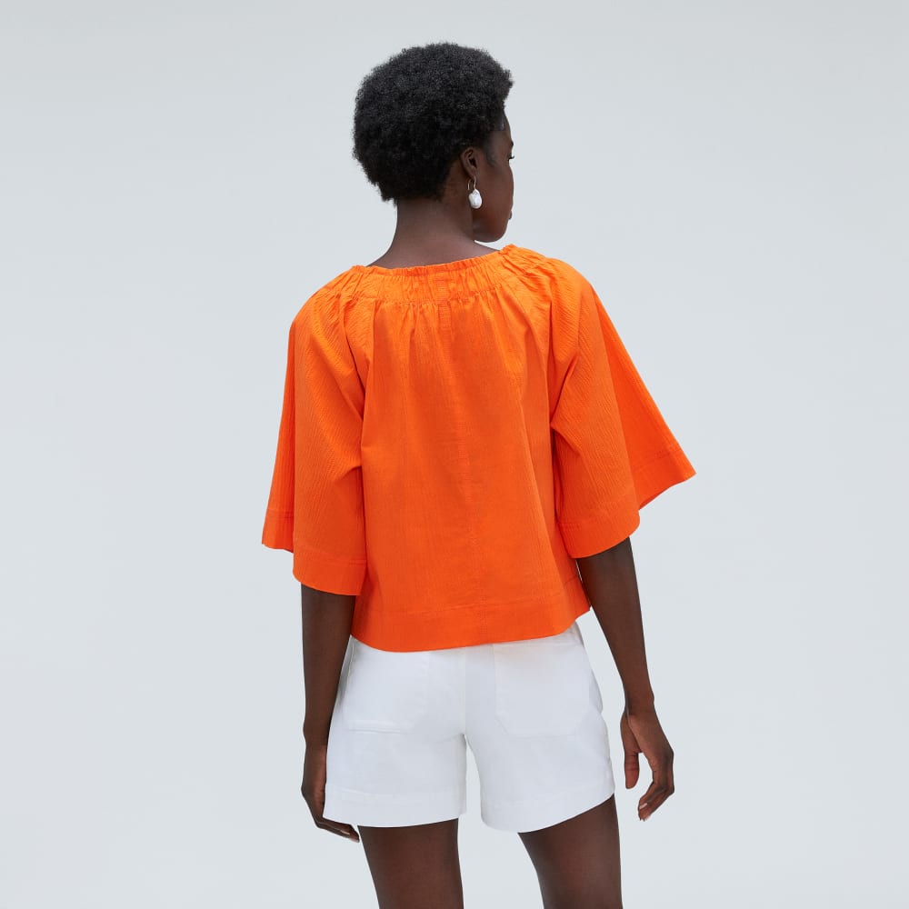 The Seersucker Gathered Tee in Bright Orange — detail view