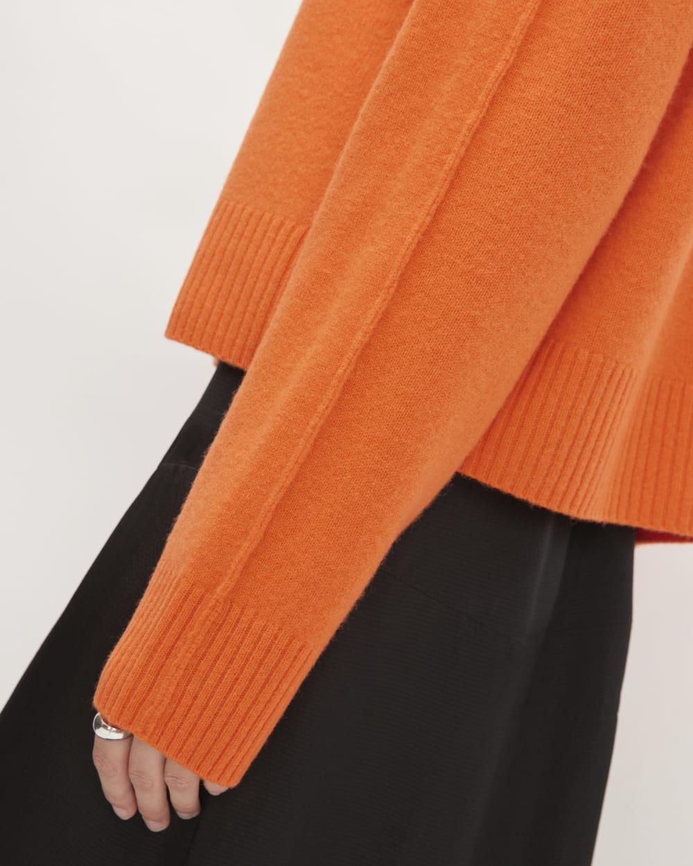 The Good Merino Wool Mockneck Sweater in Orange — detail view