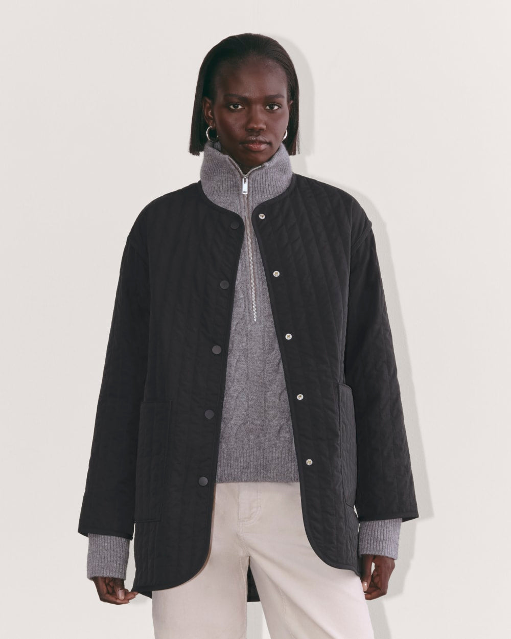 The Midi Quilted Liner in Black — front view