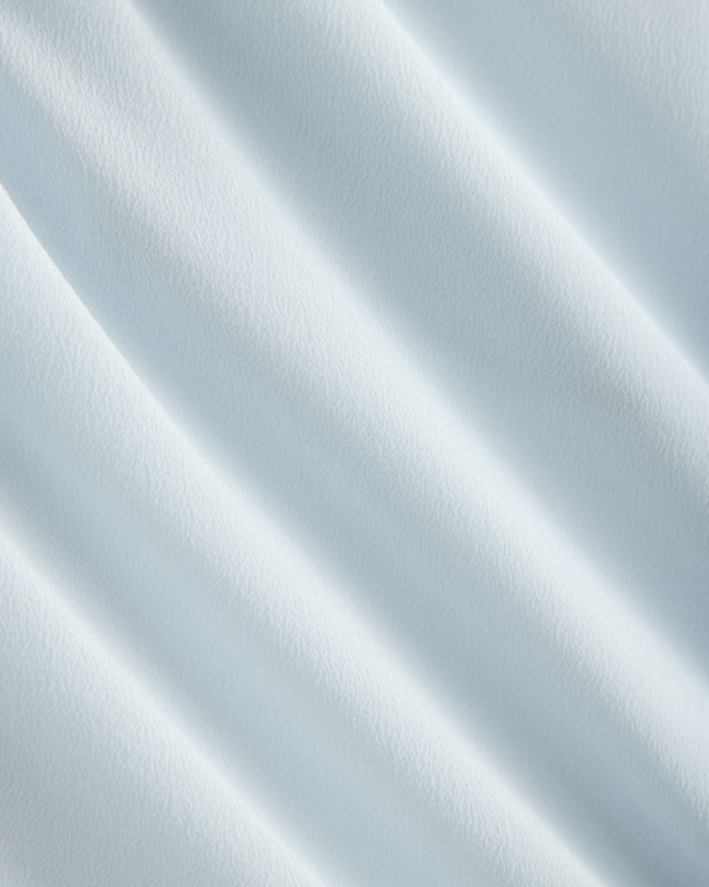 The Boxy Shirt in Washable Silk in Skywriting — detail view