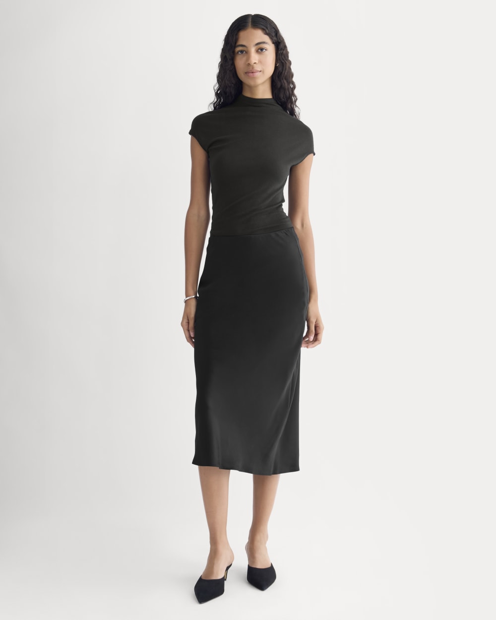 Slip Skirt in Silk Charmeuse in Black — front view