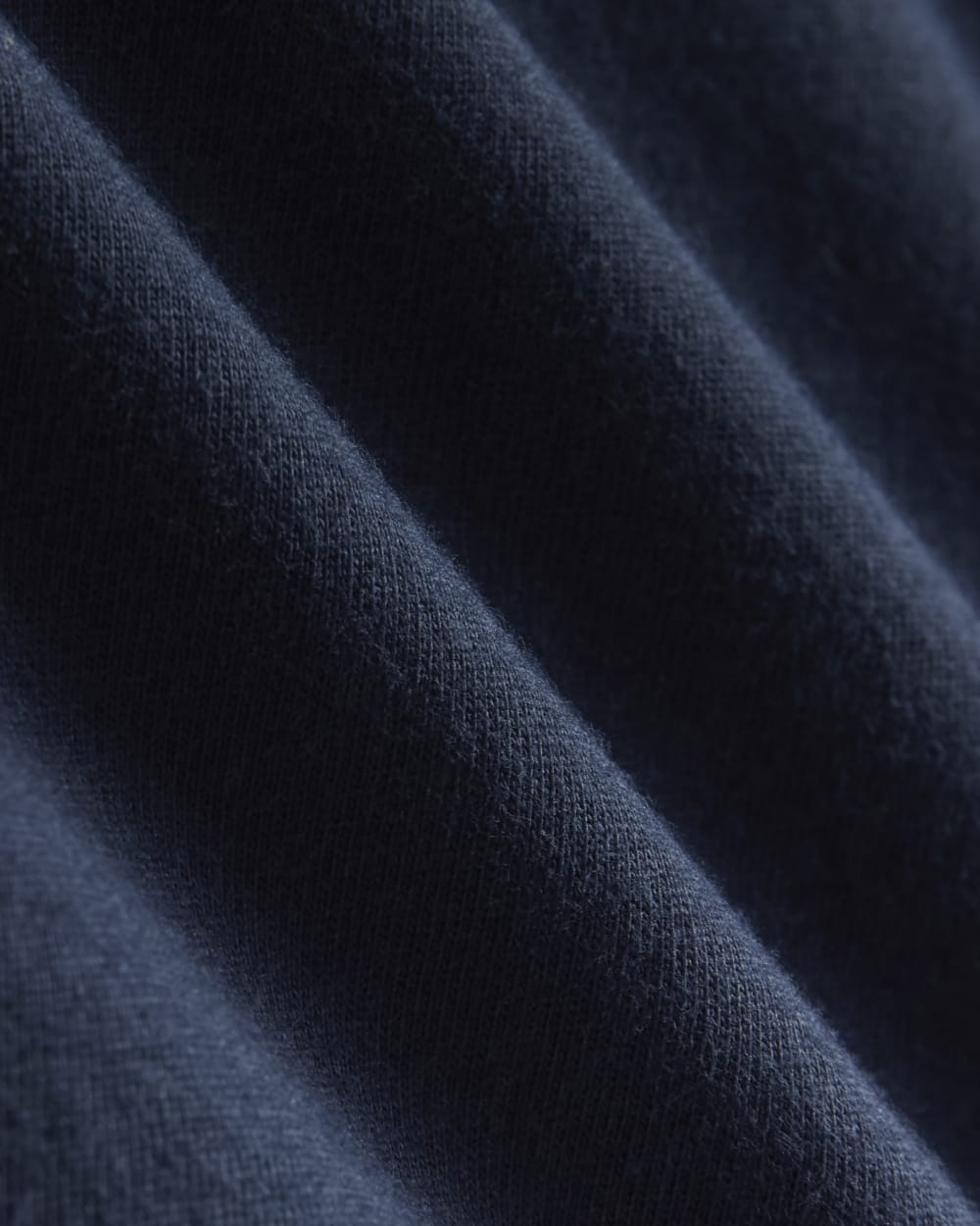 The Slim Long-Sleeve Crew in Essential Cotton in Navy — detail view