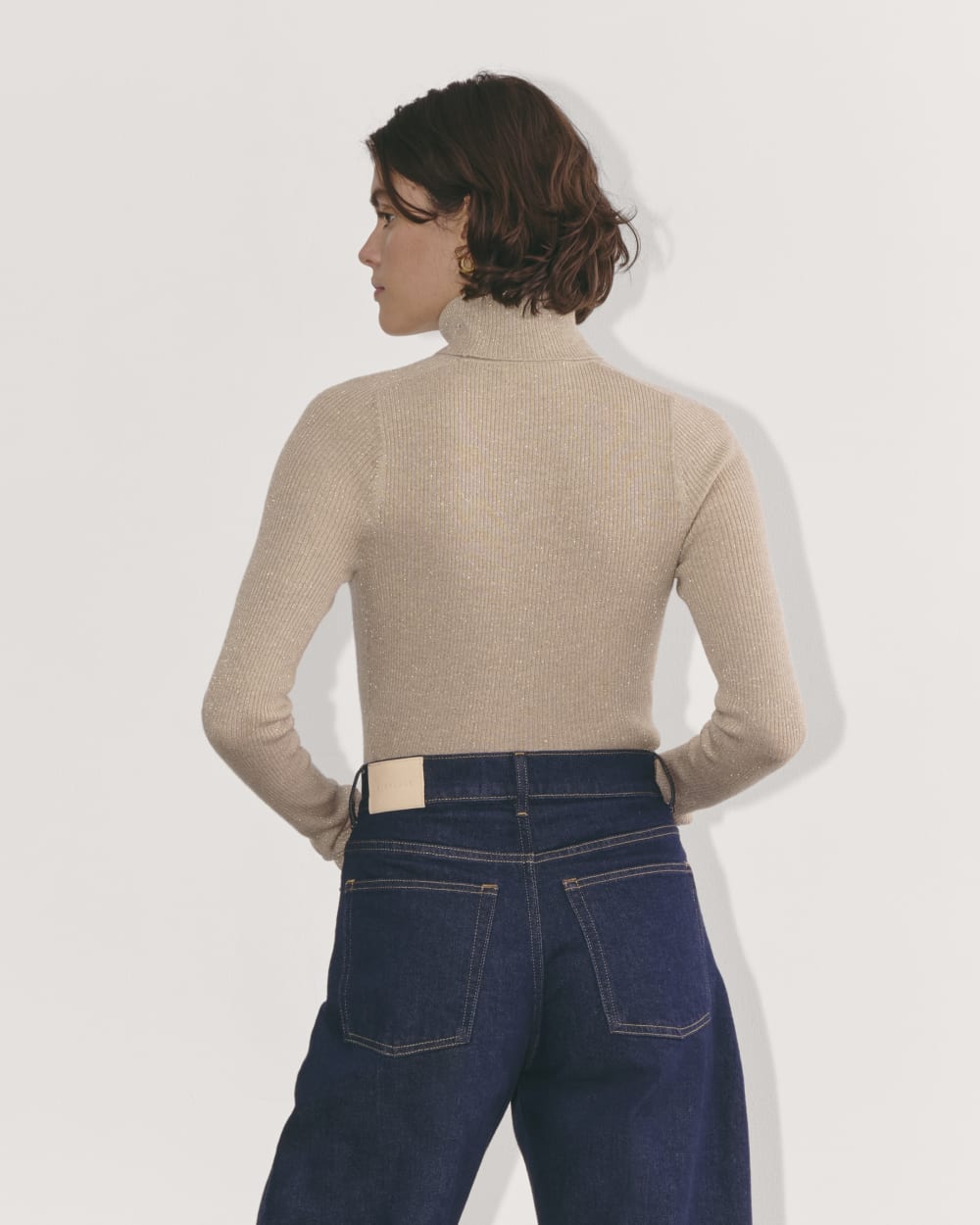 The Turtleneck in Lurex Merino in Gold — detail view