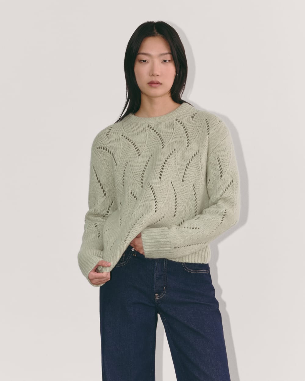 The Pointelle Sweater in Cloud in Seagrass — front view