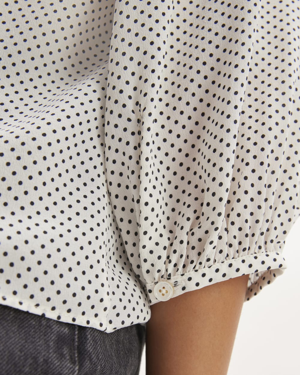 The Washable Clean Silk V-Neck Top in Bone / Black Polka Dot — detail view