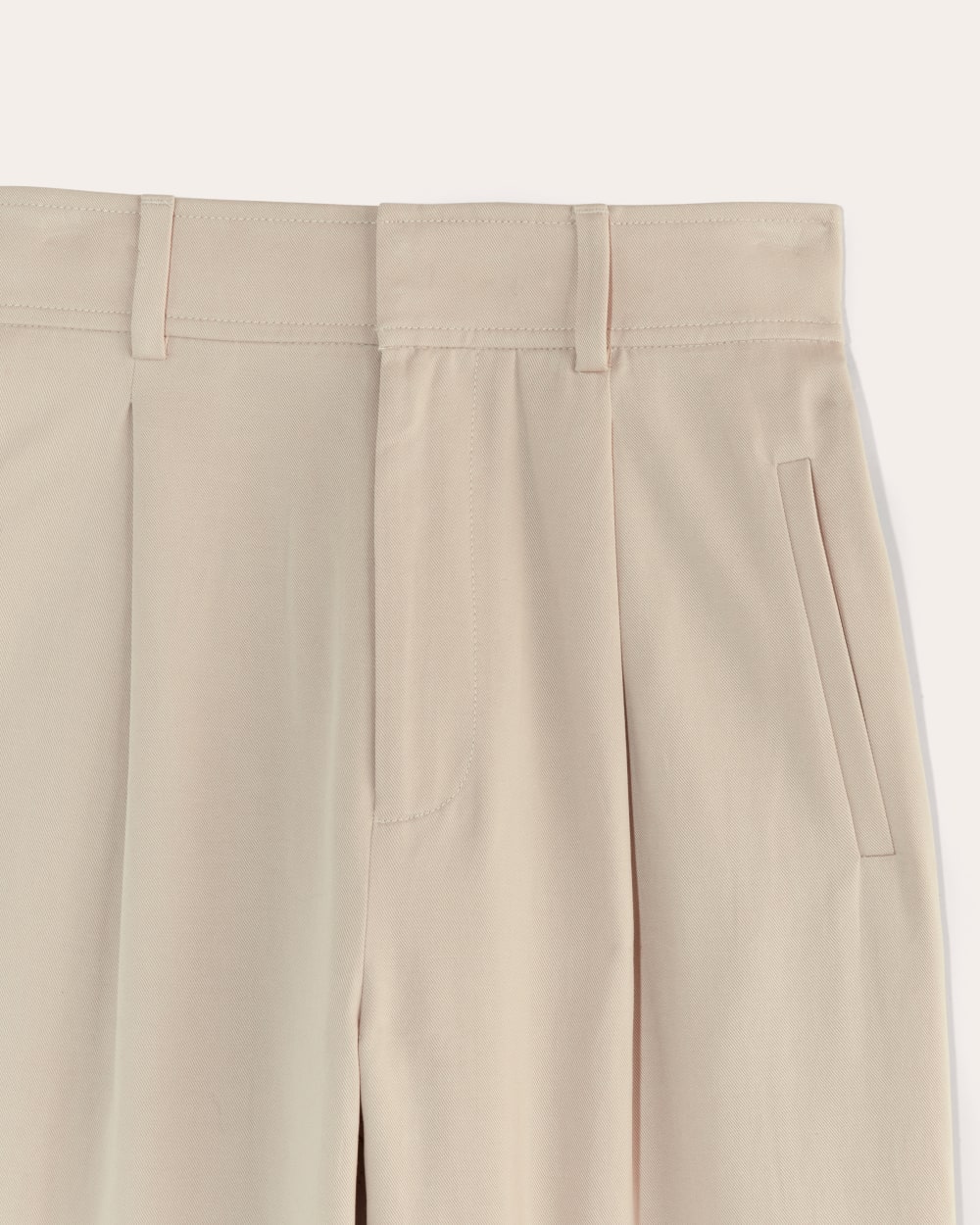 The Draper Pleated Pant in Buttersmooth in Sandstone — detail view