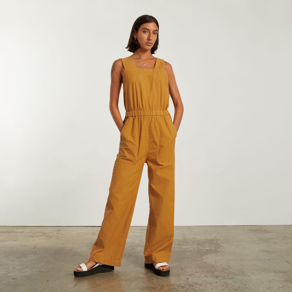 The Fatigue Apron Jumpsuit in Amber — front view