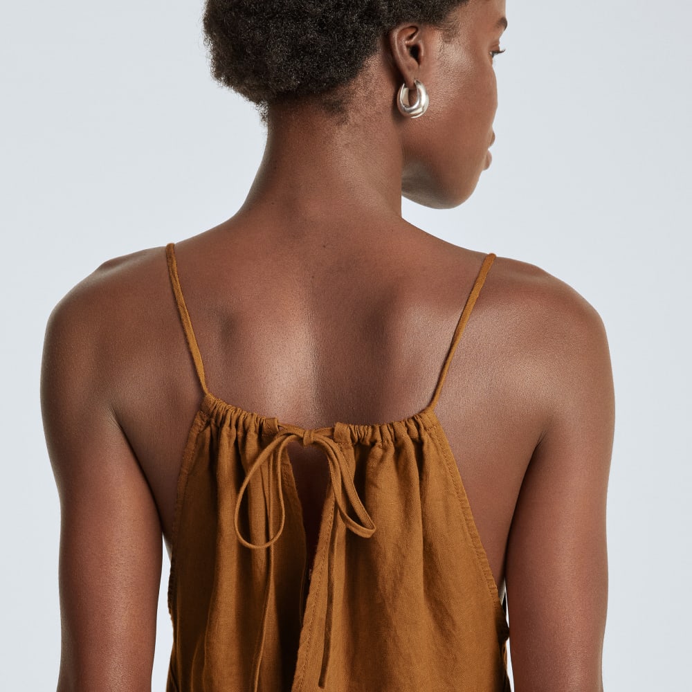 The Linen Shoestring Jumpsuit in Tawny Brown — detail view