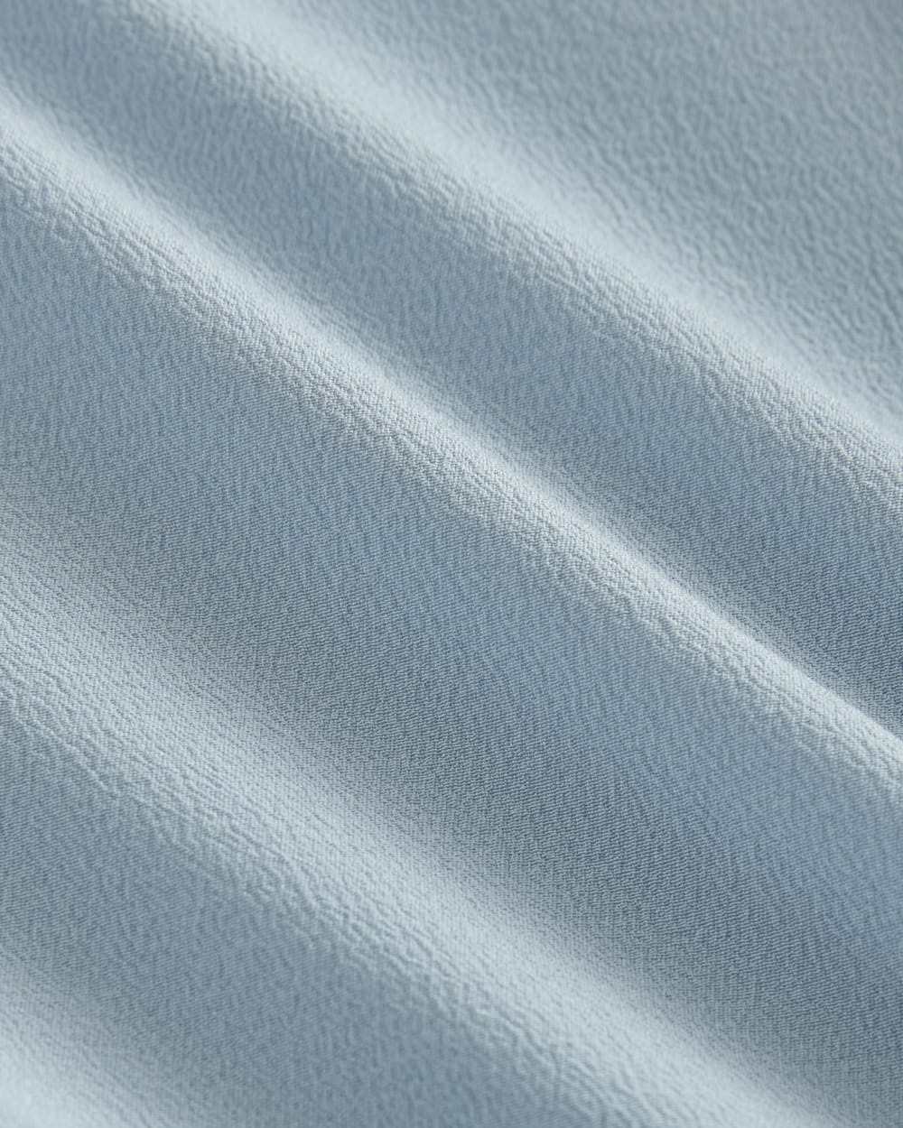 The Popover Top in Washable Silk in Soft Blue — detail view