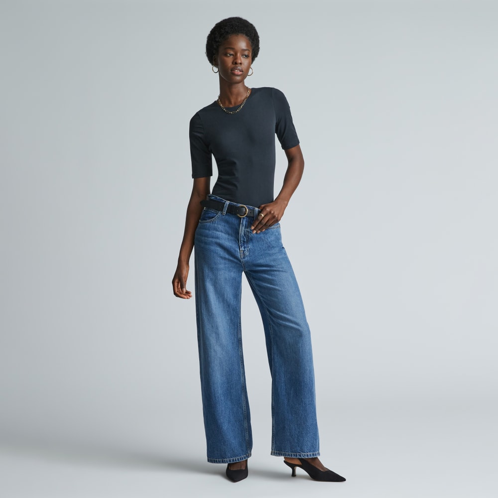 The Short-Sleeve Crew Neck Bodysuit in Black — front view