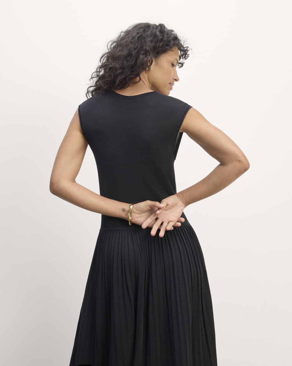 The Knit Pleated Dress in Black — detail view