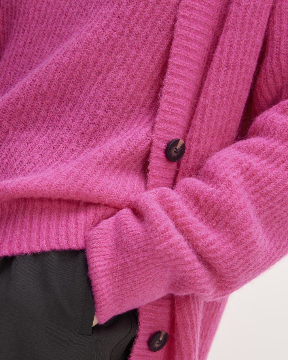 The Alpaca Oversized Cardigan in Fuchsia Pink — detail view