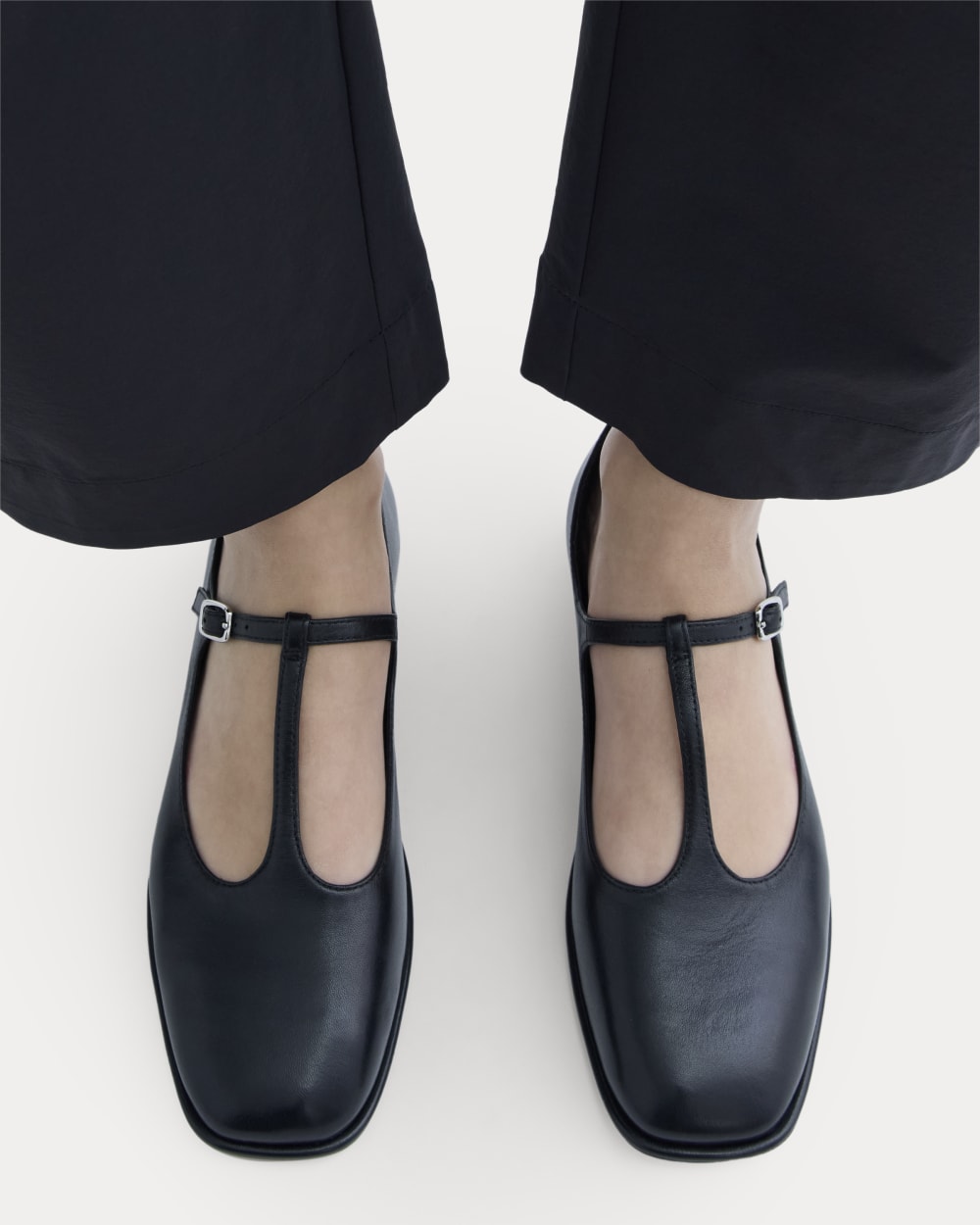 The Leather T-Strap Flat in Black — detail view
