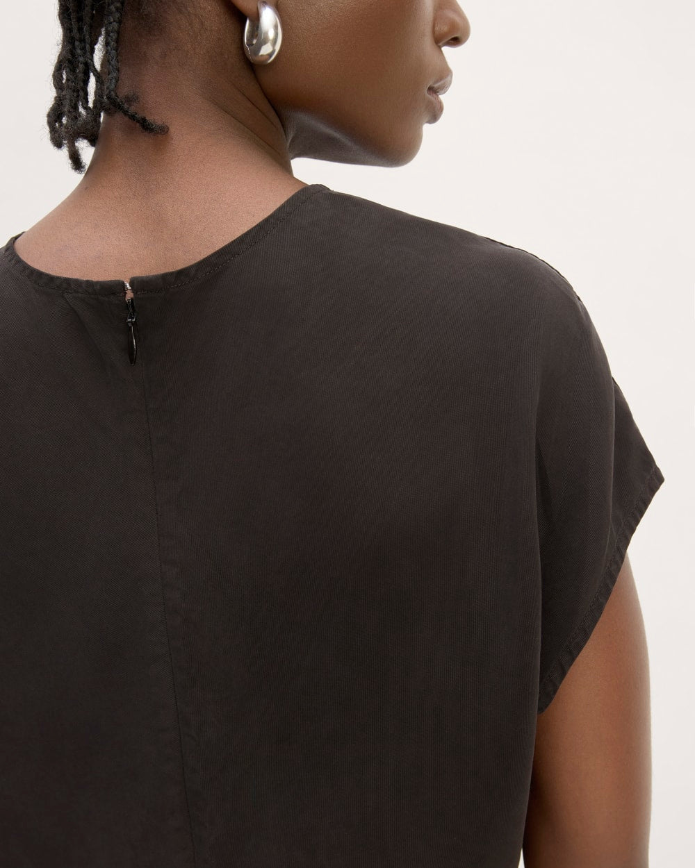 The Drape Top in Butterlite in Black — detail view