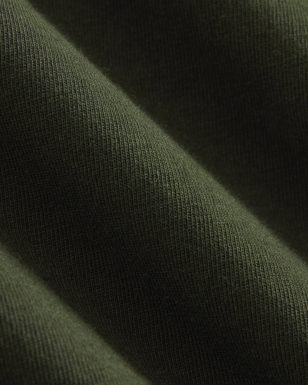 The Box-Cut Tee in Essential Cotton in Dark Green — detail view