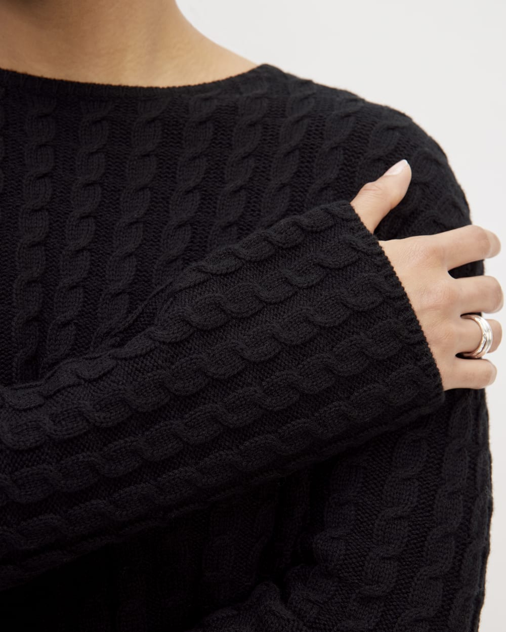 The Cotton Merino Cable Crew in Black — detail view