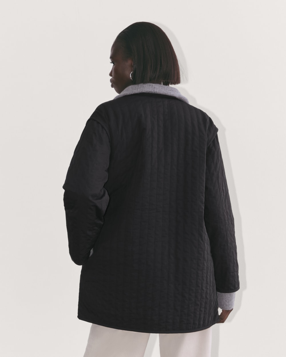 The Midi Quilted Liner in Black — detail view