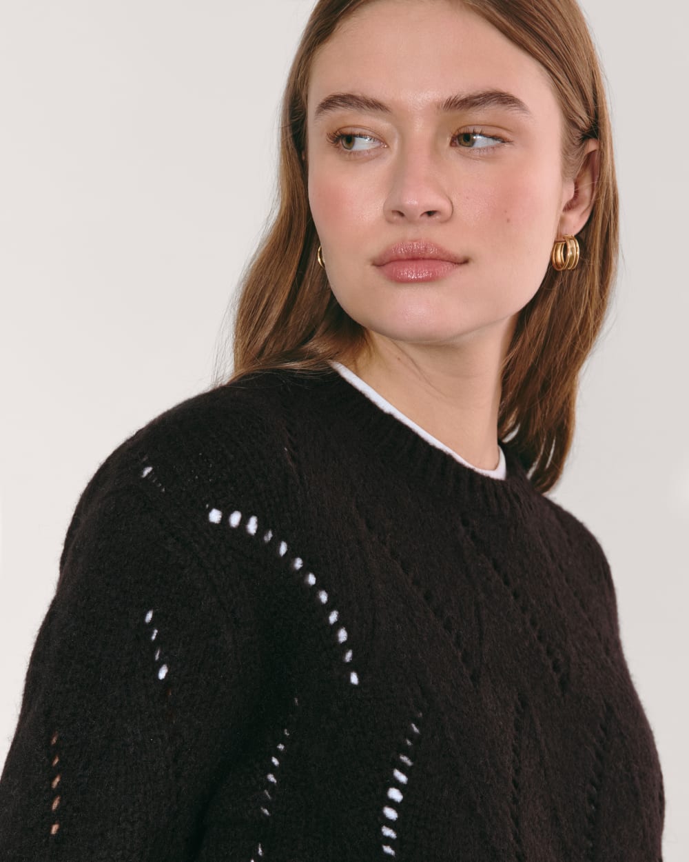 The Pointelle Sweater in Cloud in Black — detail view