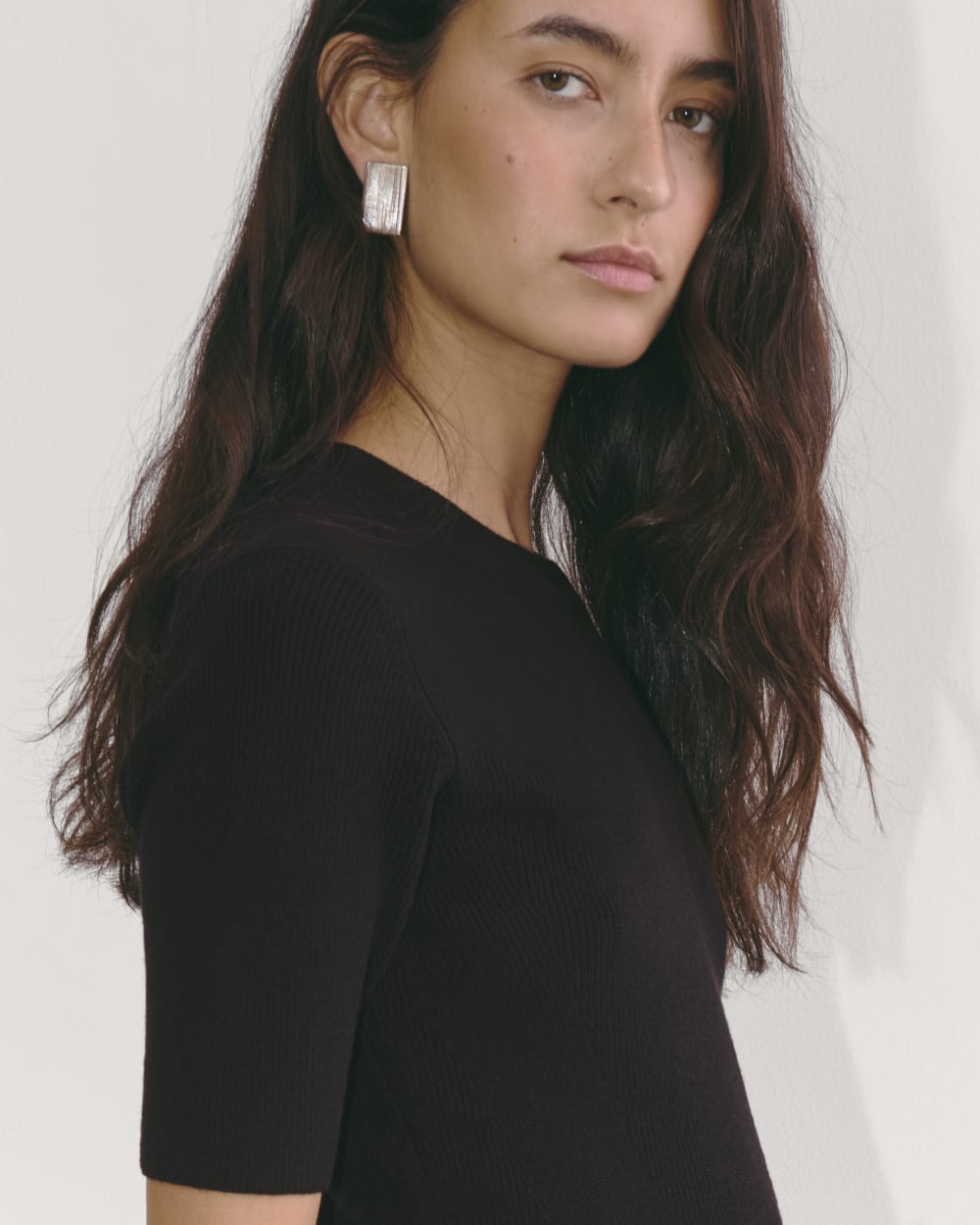 The Ribbed Sweater Dress in Black — detail view