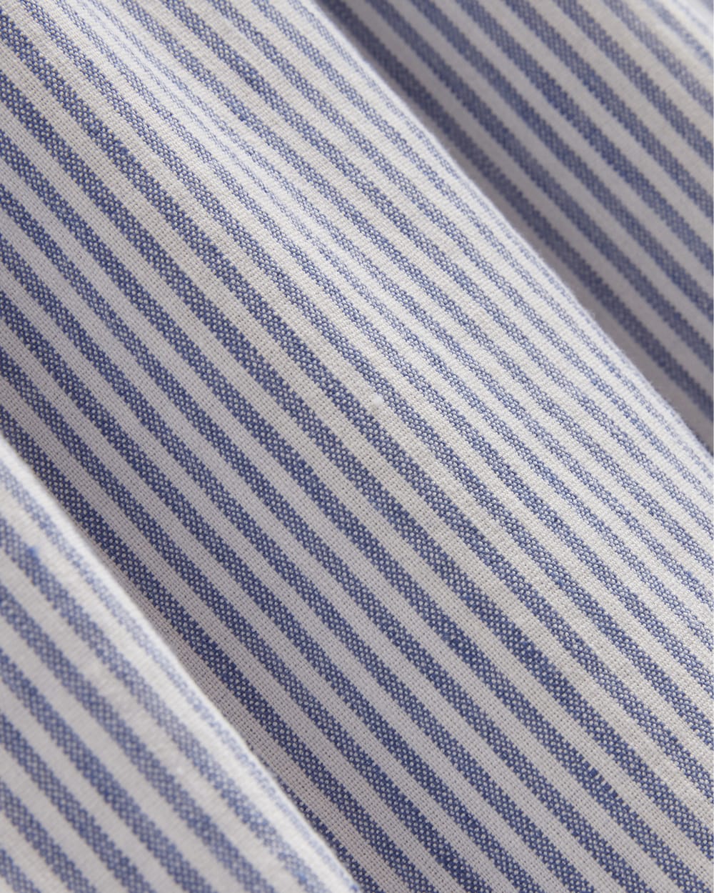 The Flutter-Sleeve Dress in Stretch Linen in White / Dutch Blue — detail view