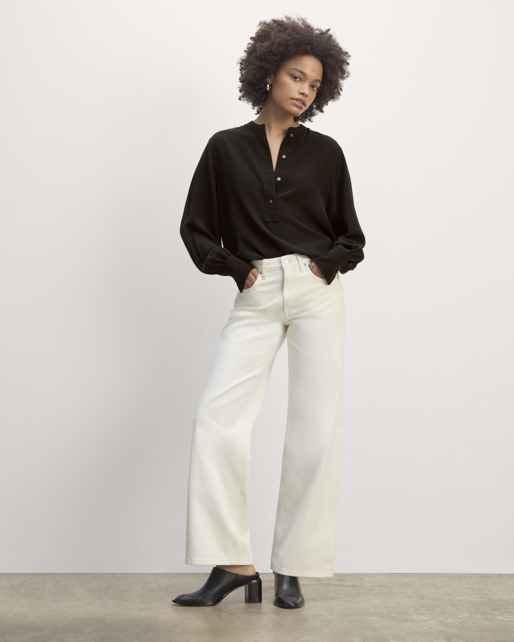 The Henley Shirt in Washable Silk in Black — detail view