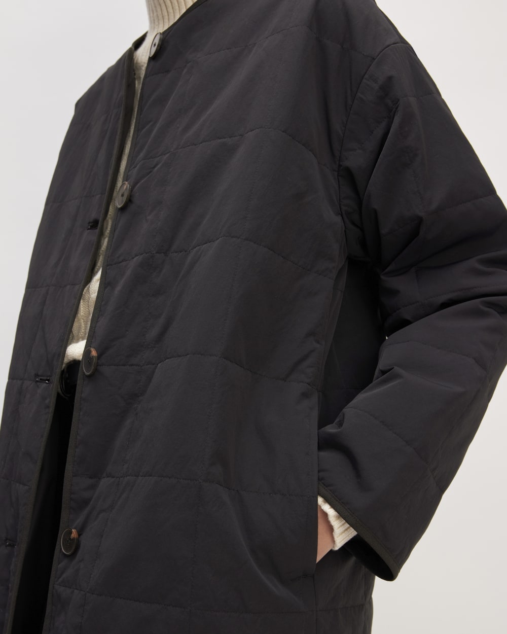 The ReNew Quilted Long Liner in Black — detail view