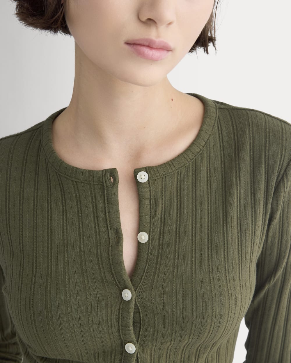 Cardigan in Pointelle in Olive Night — detail view