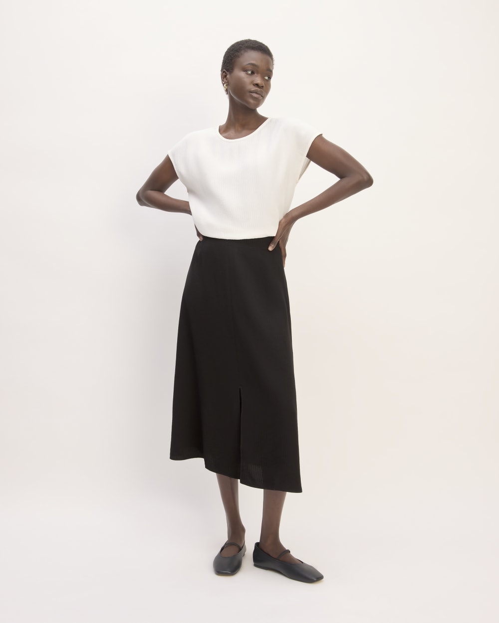 The Mini Jacquard Stripe Slip Skirt in Black — front view