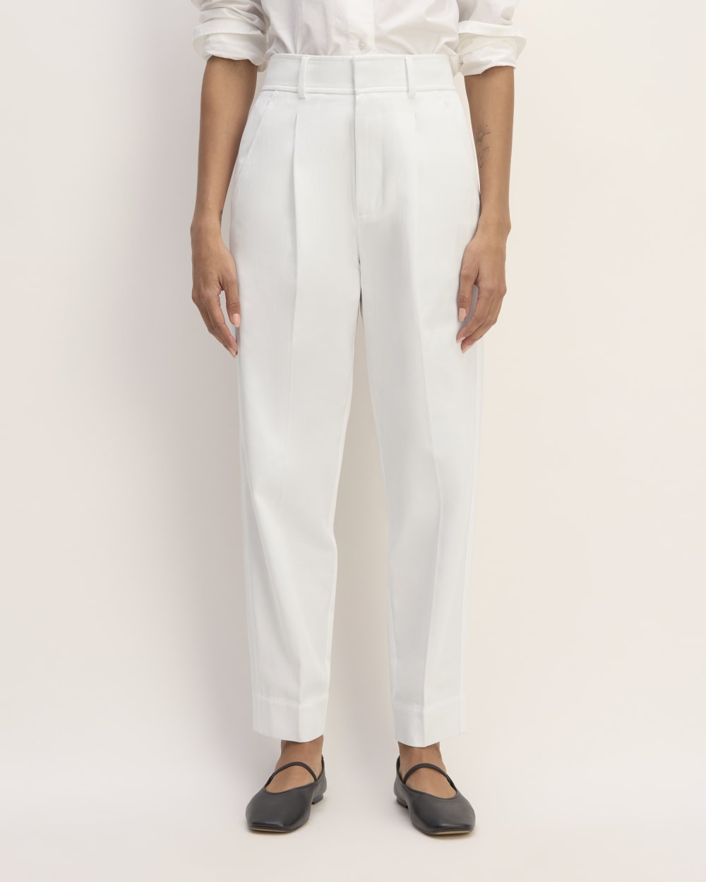 The Draper Tapered Pant in Buttersmooth in White — detail view