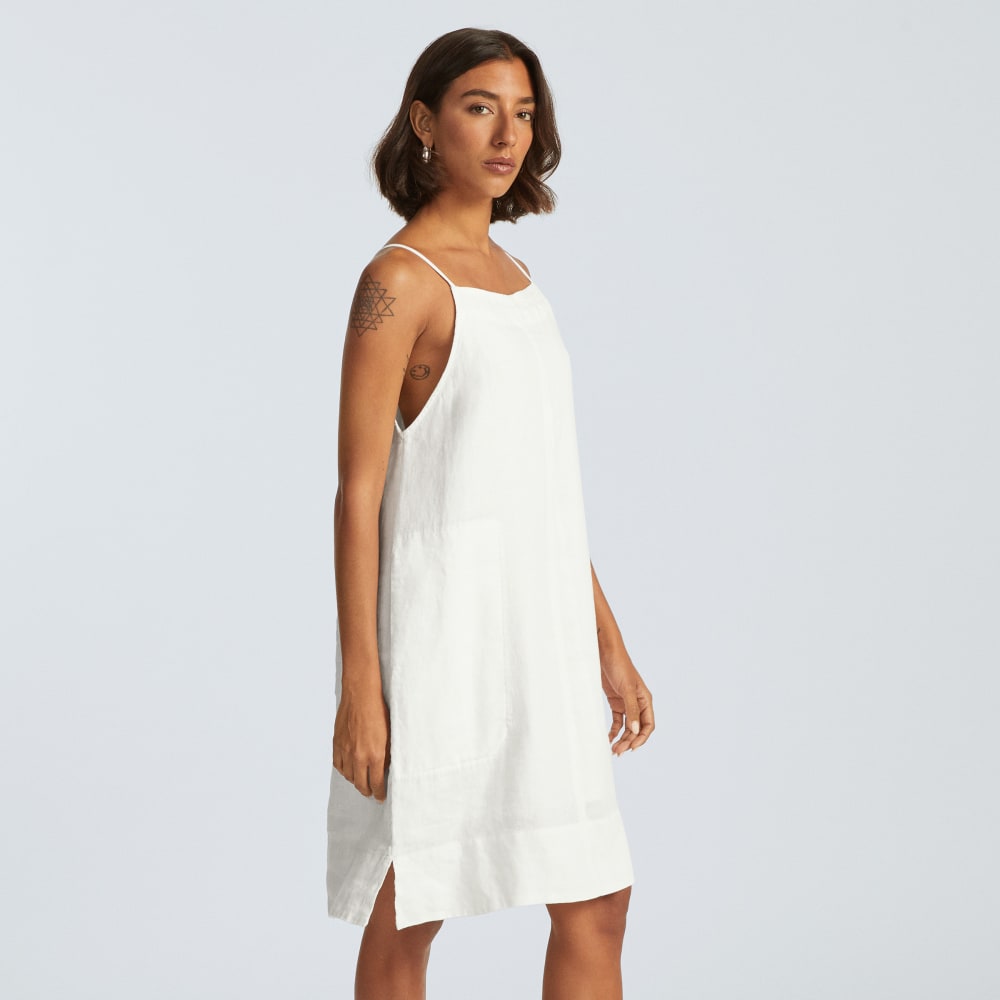 The Linen Apron Dress in White — detail view