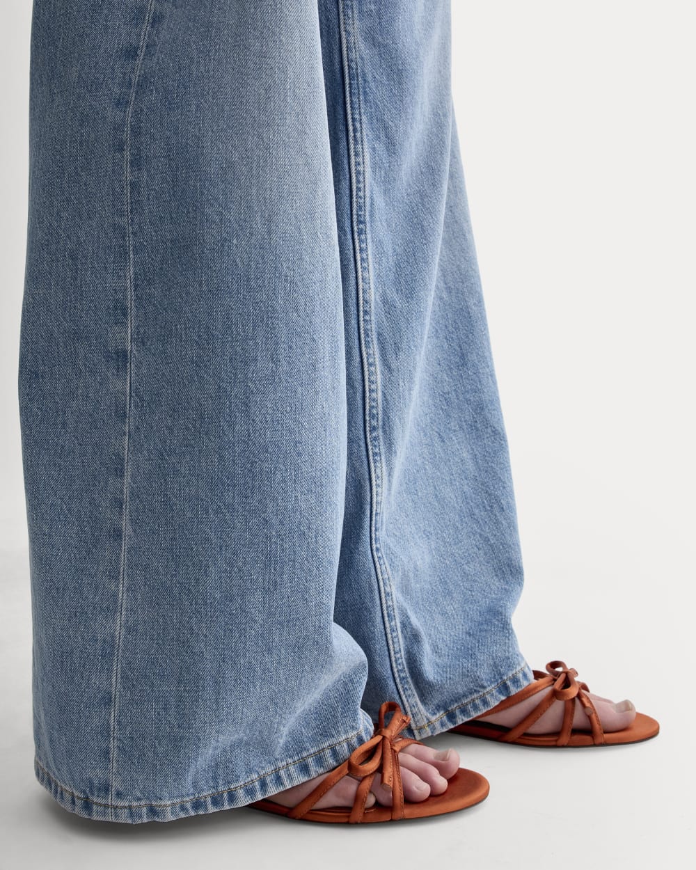 The Bow Sandal in Deep Amber Satin — detail view