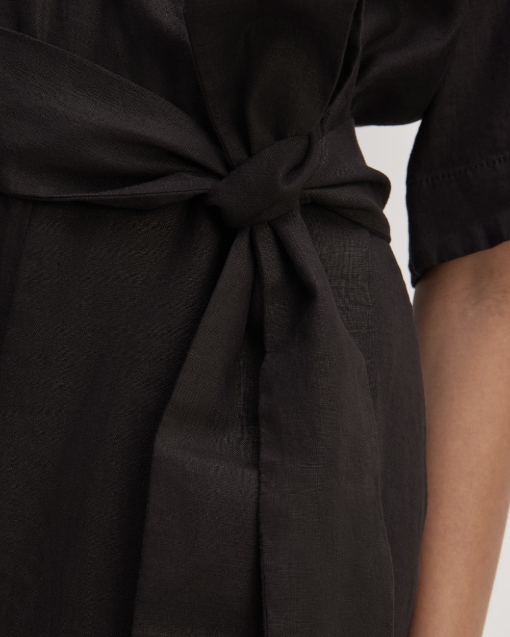 The Wrap Jumpsuit in Linen in Black — detail view