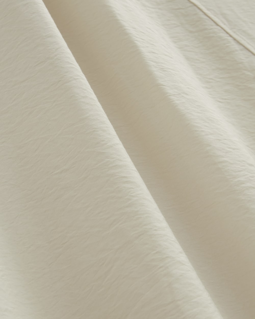 The V-Neck Dress in SoftLuxe in Sandshell — detail view